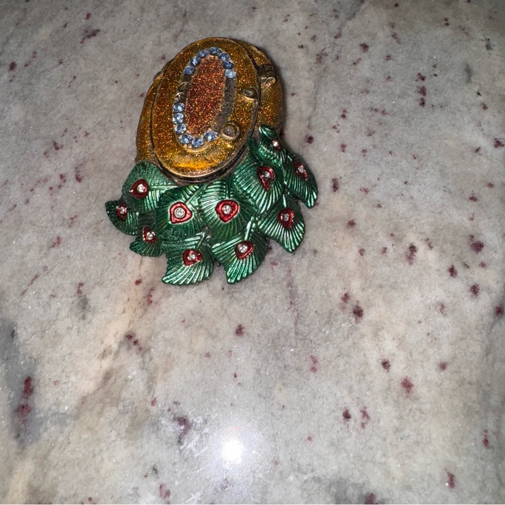 a decorative trinket holder with a gold gold and clear crystals trinket